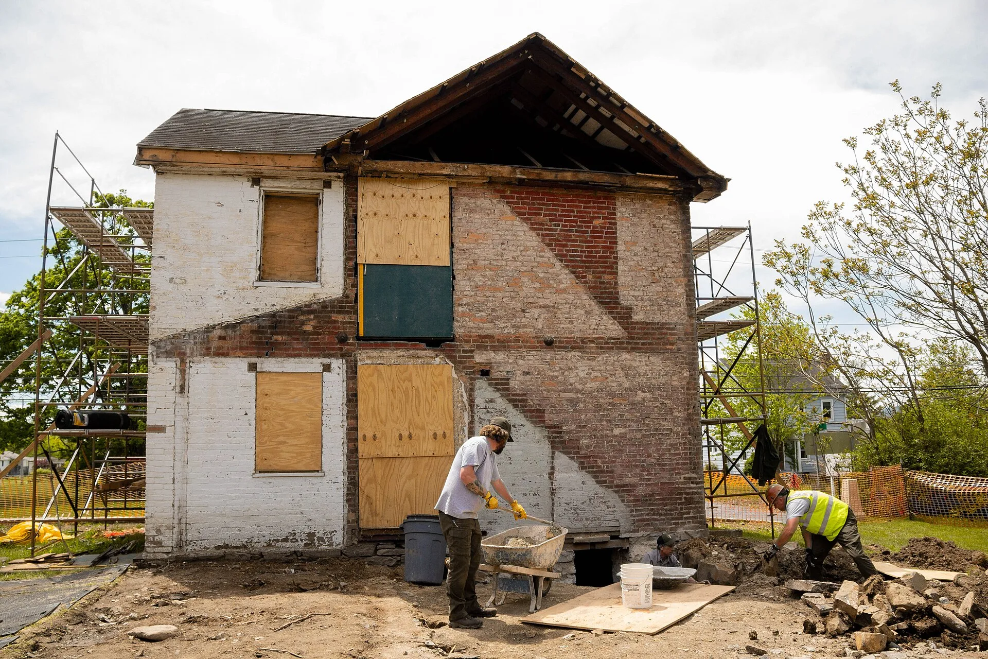 Preservationists mix mortar by hand in a wheel barrow to complete foundation wall masonry infills. Keywords: gettysburg; gettysburg national military park; wisler; battlefield; reconstruction; civil war; homes; virtual experience; historic preservation. Historic Home Materials Maintenance by Season