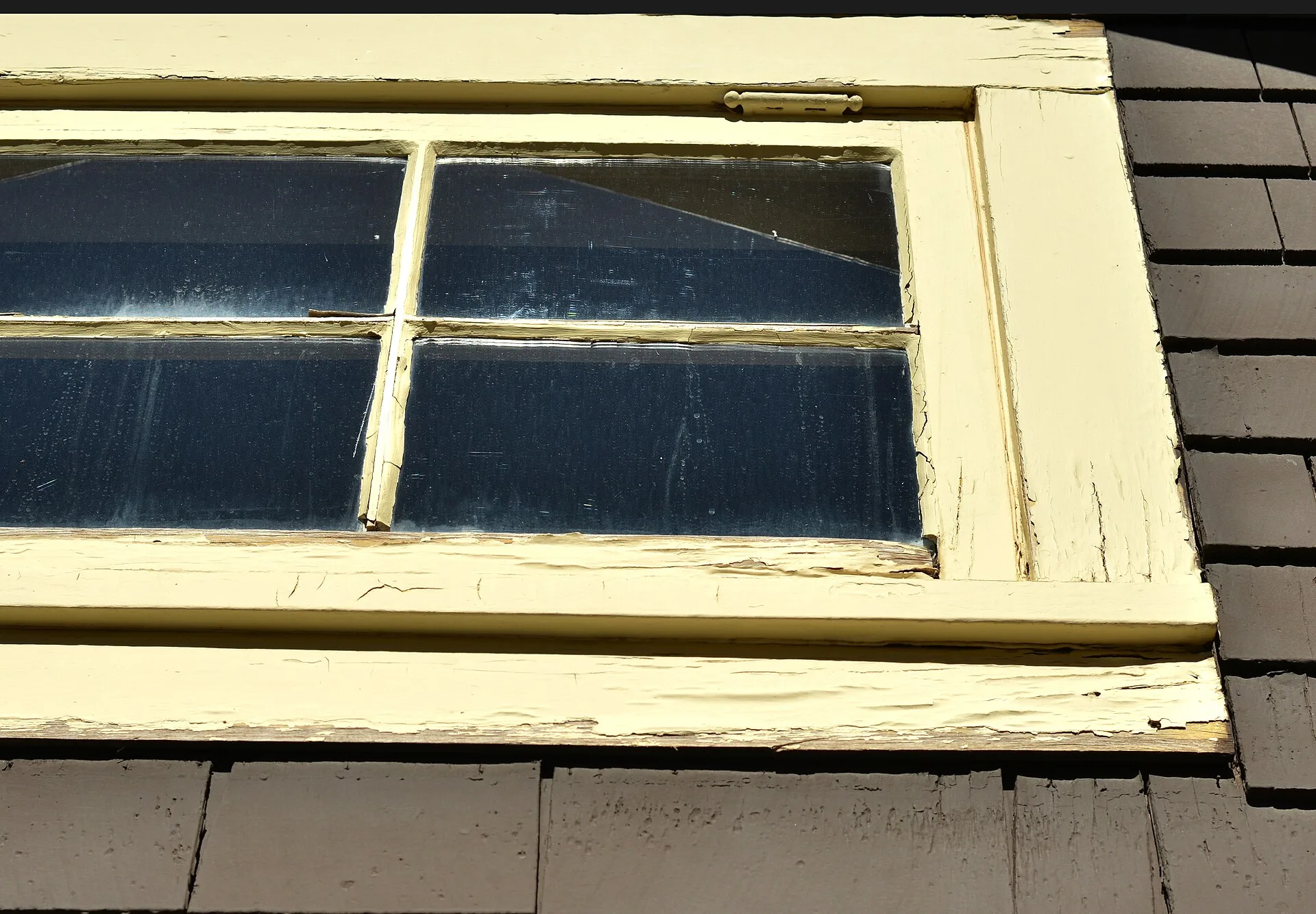 Restorative work on windows - involves removal of failed modern latex paints and glazing compounds, and reinstallation of linseed based glazing putty and solvent free linseed based paints. The historic linseed based materials will long outlast the modern finishes, which for a building like Kolb Stud. For homeowners, the tempting shortcut and the lasting repair compared
